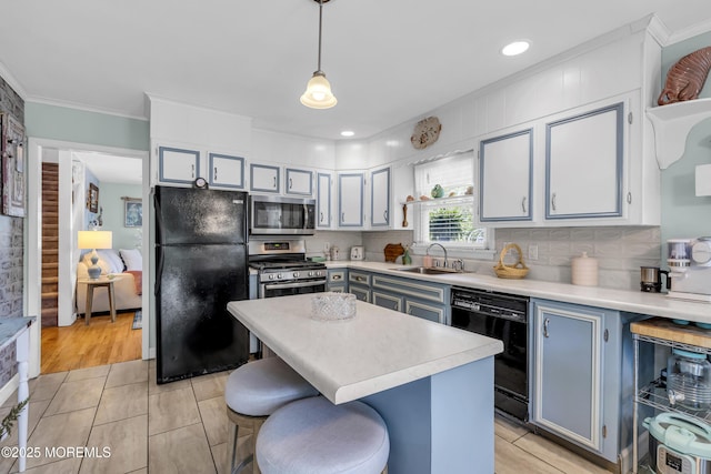 553 Kingfisher Cir, Brick, NJ 08723 - kitchen with black appliances, light countertops, ornamental molding, a kitchen bar, and pendant lighting