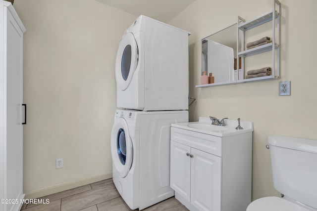 553 Kingfisher Cir, Brick, NJ 08723 - washroom with stacked washing machine and dryer and baseboards