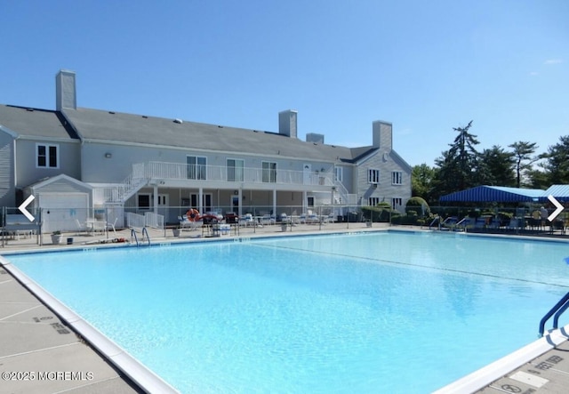 164 Cours De Clemenceau Unit E, Freehold, NJ 07728 - community pool featuring stairway