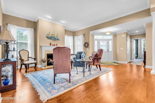 7 Bay Head Ct, Waretown, NJ 08758 - living area featuring light wood finished floors, healthy amount of natural light, a fireplace with flush hearth, ornamental molding, and recessed lighting