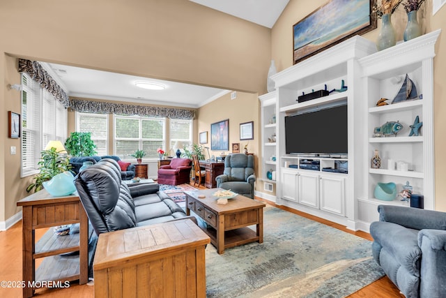 7 Bay Head Ct, Waretown, NJ 08758 - living room featuring wood finished floors, crown molding, built in shelves, and lofted ceiling