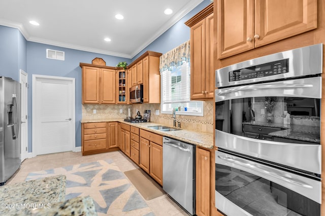 7 Bay Head Ct, Waretown, NJ 08758 - kitchen with stainless steel appliances, crown molding, backsplash, light stone counters, and recessed lighting