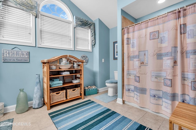 7 Bay Head Ct, Waretown, NJ 08758 - bathroom featuring lofted ceiling, tile patterned flooring, and curtained shower