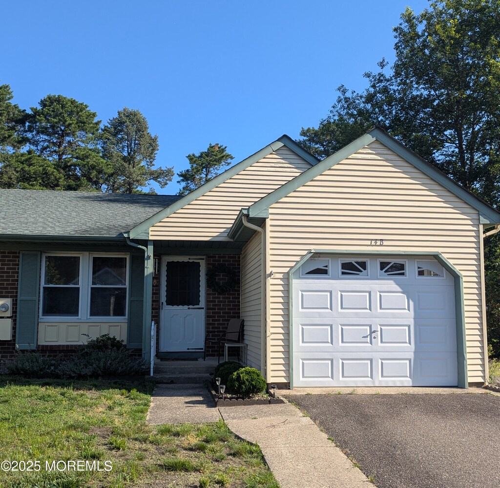 14B Birchwood Dr, Whiting, NJ 08759 - single story home with an attached garage, asphalt driveway, and brick siding