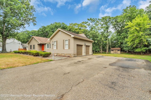 716 Hyson Rd, Jackson, NJ 08527 - ranch-style home featuring a shed, a front lawn, a garage, and driveway