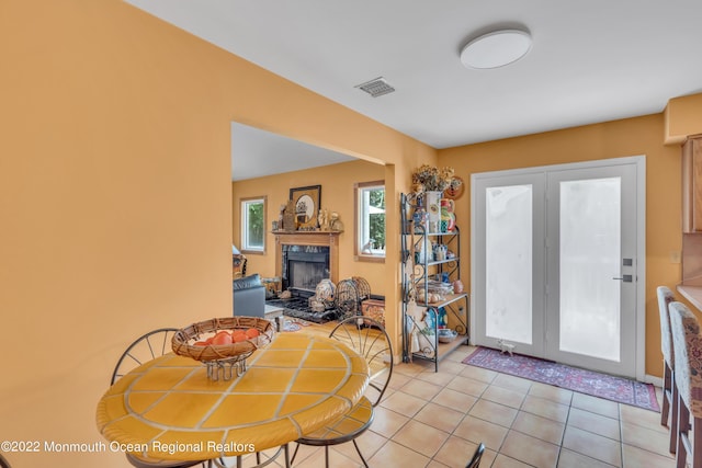 716 Hyson Rd, Jackson, NJ 08527 - dining room with a high end fireplace and light tile patterned flooring