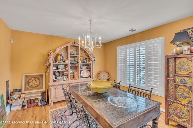 716 Hyson Rd, Jackson, NJ 08527 - dining area with a chandelier and light wood-type flooring