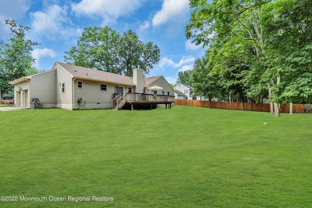 716 Hyson Rd, Jackson, NJ 08527 - rear view of house featuring a deck, a garage, a chimney, and stairs