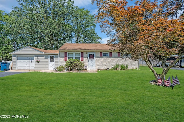 530 Aldrich Rd, Howell, NJ 07731 - ranch-style home with a front yard, driveway, stone siding, and an attached garage