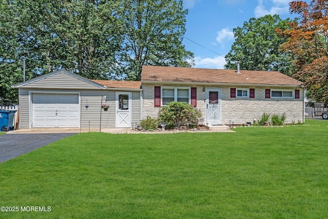 530 Aldrich Rd, Howell, NJ 07731 - ranch-style home with a front lawn, driveway, stone siding, and an attached garage