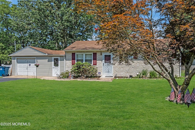530 Aldrich Rd, Howell, NJ 07731 - view of front of house with stone siding, a front lawn, asphalt driveway, and a garage