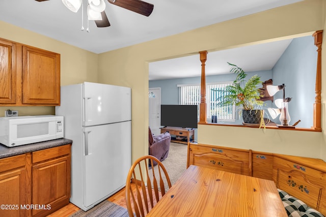 530 Aldrich Rd, Howell, NJ 07731 - kitchen with white appliances, ceiling fan, brown cabinets, and light wood-style flooring