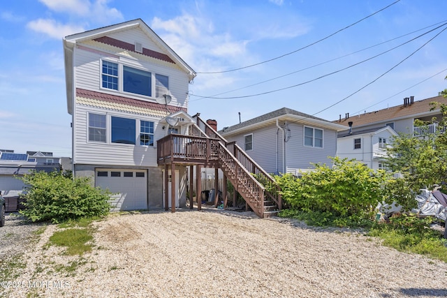 118 Sampson Ave, Seaside Heights, NJ 08751 - coastal home with dirt driveway, stairs, a garage, and a wooden deck