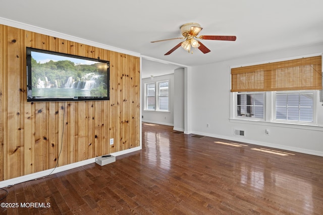 118 Sampson Ave, Seaside Heights, NJ 08751 - empty room with wood finished floors, wooden walls, a ceiling fan, and crown molding