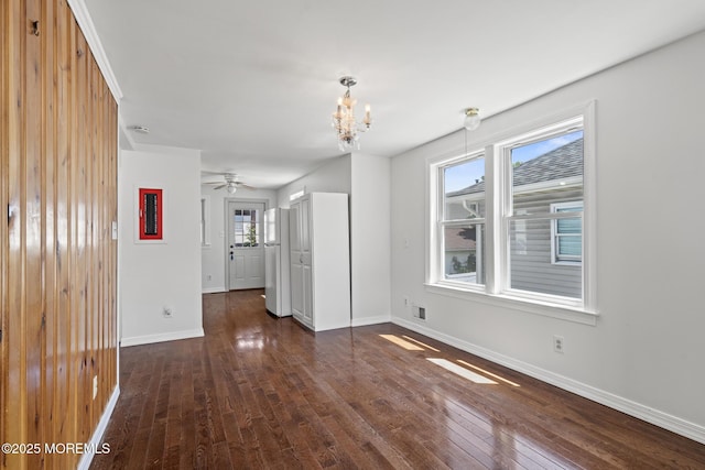 118 Sampson Ave, Seaside Heights, NJ 08751 - unfurnished living room featuring dark wood-type flooring, plenty of natural light, a chandelier, and ceiling fan