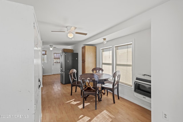 118 Sampson Ave, Seaside Heights, NJ 08751 - dining room with heating unit, ceiling fan, light wood-style flooring, and plenty of natural light