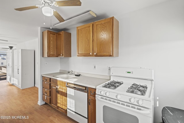 118 Sampson Ave, Seaside Heights, NJ 08751 - kitchen with white appliances, a ceiling fan, light wood finished floors, brown cabinetry, and light countertops