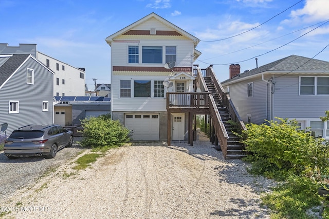 118 Sampson Ave, Seaside Heights, NJ 08751 - beach home featuring stairs, an attached garage, and driveway