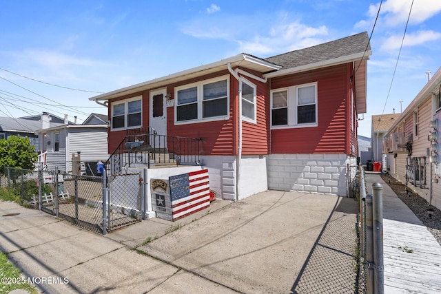 242 Sherman Ave, Seaside Heights, NJ 08751 - view of front of property featuring a gate, a fenced front yard, and roof with shingles