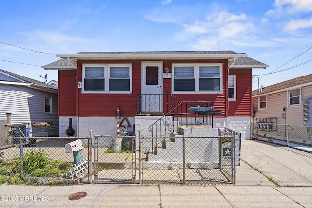 242 Sherman Ave, Seaside Heights, NJ 08751 - view of front facade featuring a gate, a fenced front yard, and a shingled roof