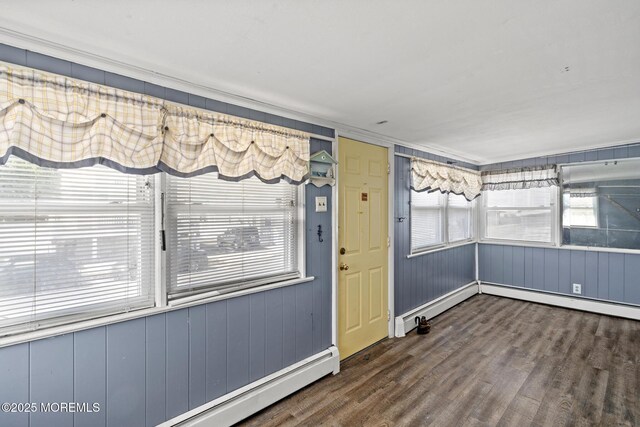 242 Sherman Ave, Seaside Heights, NJ 08751 - empty room featuring wood finished floors and a baseboard heating unit