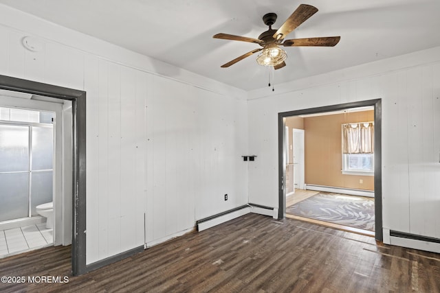 242 Sherman Ave, Seaside Heights, NJ 08751 - spare room featuring a baseboard radiator, wood finished floors, a ceiling fan, and a smoke detector