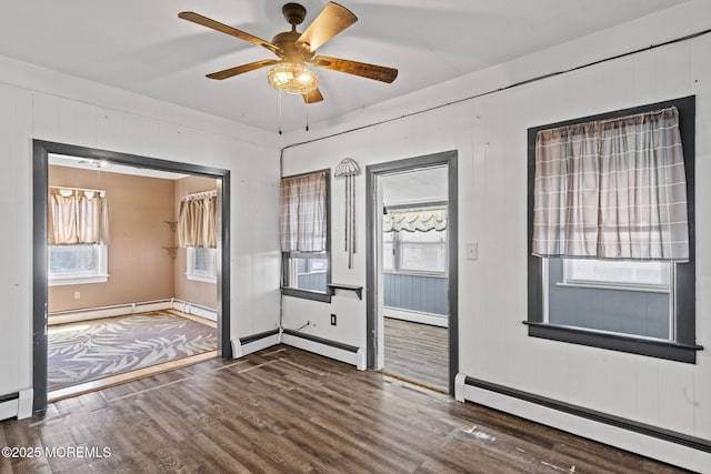 242 Sherman Ave, Seaside Heights, NJ 08751 - unfurnished room featuring a baseboard heating unit and wood finished floors