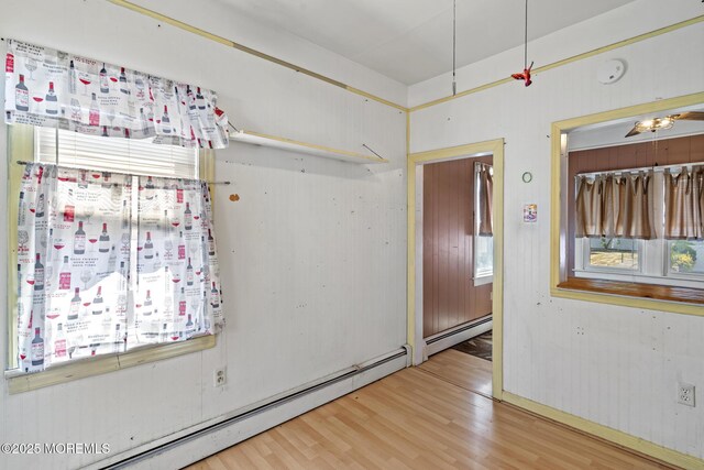 242 Sherman Ave, Seaside Heights, NJ 08751 - empty room featuring baseboard heating and wood finished floors