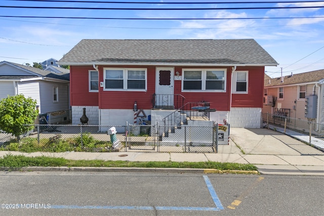 242 Sherman Ave, Seaside Heights, NJ 08751 - view of front of house with a fenced front yard and a shingled roof