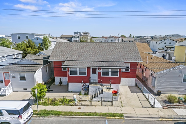 242 Sherman Ave, Seaside Heights, NJ 08751 - view of front of home featuring a residential view, a fenced front yard, entry steps, and roof with shingles