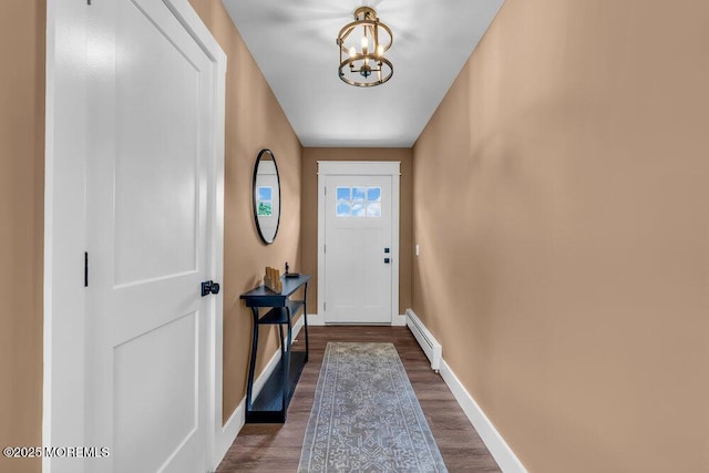 3 Andover Ct, Toms River, NJ 08757 - doorway featuring a baseboard heating unit, a chandelier, and dark wood-style floors