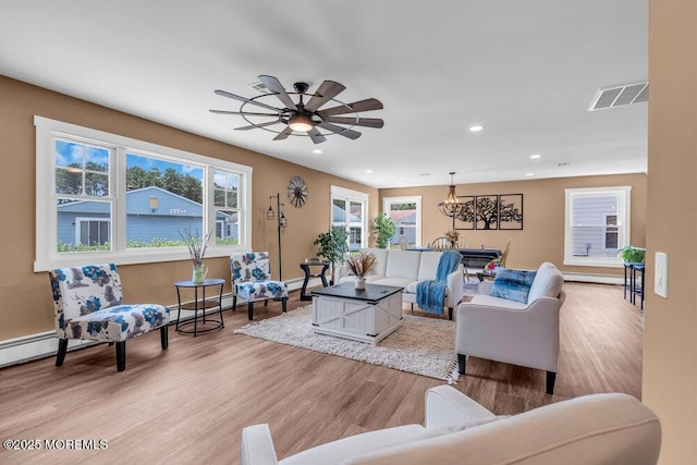 3 Andover Ct, Toms River, NJ 08757 - living room with light wood-style flooring, recessed lighting, a chandelier, and a ceiling fan
