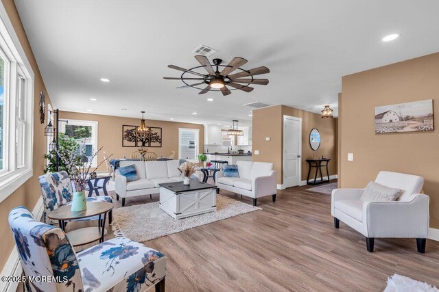 3 Andover Ct, Toms River, NJ 08757 - living area featuring light wood finished floors, recessed lighting, a chandelier, and ceiling fan