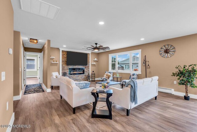 3 Andover Ct, Toms River, NJ 08757 - living area featuring wood finished floors, ceiling fan, recessed lighting, a large fireplace, and a baseboard radiator