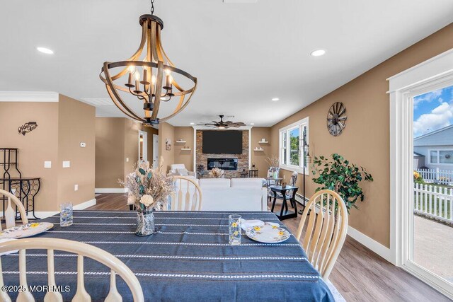 3 Andover Ct, Toms River, NJ 08757 - dining area featuring a fireplace, a chandelier, wood finished floors, ceiling fan, and recessed lighting