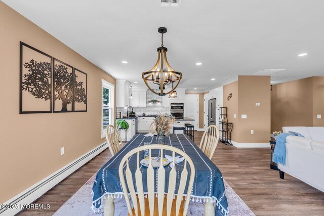 3 Andover Ct, Toms River, NJ 08757 - dining room featuring baseboard heating, a chandelier, recessed lighting, and dark wood-style flooring