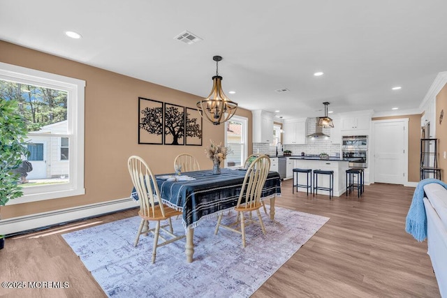3 Andover Ct, Toms River, NJ 08757 - dining space with a baseboard heating unit, healthy amount of natural light, a chandelier, light wood-style flooring, and recessed lighting