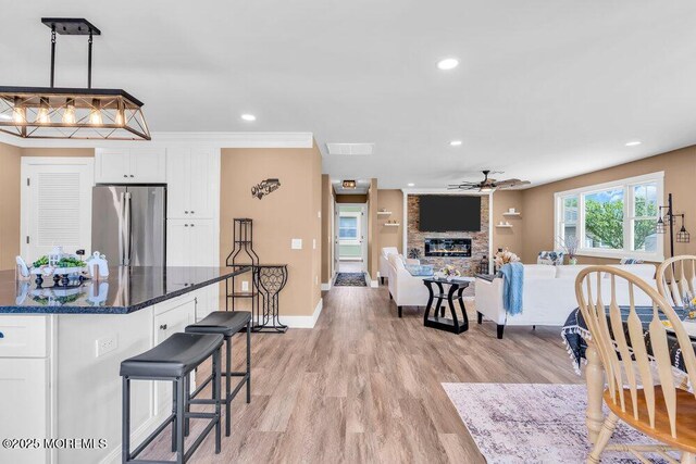 3 Andover Ct, Toms River, NJ 08757 - dining room featuring ceiling fan, a fireplace, light wood-type flooring, and recessed lighting