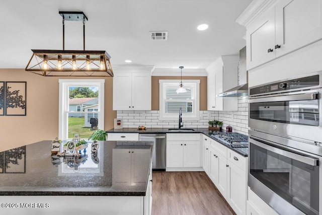 3 Andover Ct, Toms River, NJ 08757 - kitchen featuring stainless steel appliances, white cabinets, backsplash, dark stone counters, and dark wood-type flooring