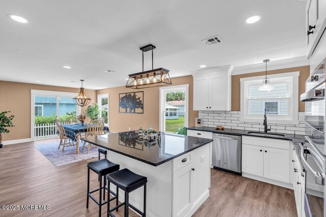 3 Andover Ct, Toms River, NJ 08757 - kitchen featuring appliances with stainless steel finishes, light wood-style floors, white cabinets, and recessed lighting