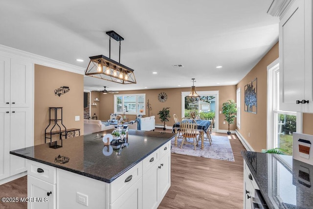 3 Andover Ct, Toms River, NJ 08757 - kitchen featuring recessed lighting, wood finished floors, white cabinets, plenty of natural light, and hanging light fixtures