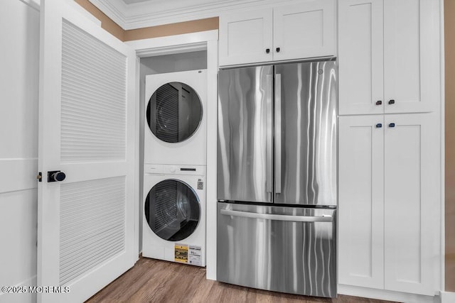 3 Andover Ct, Toms River, NJ 08757 - laundry room with stacked washer / dryer, wood finished floors, and ornamental molding
