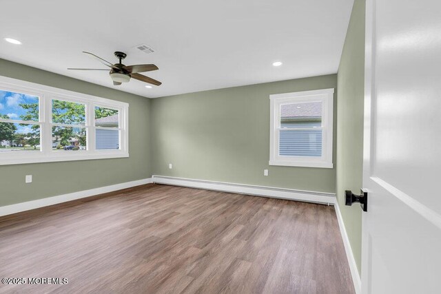 3 Andover Ct, Toms River, NJ 08757 - unfurnished room with a baseboard heating unit, a ceiling fan, wood finished floors, and recessed lighting