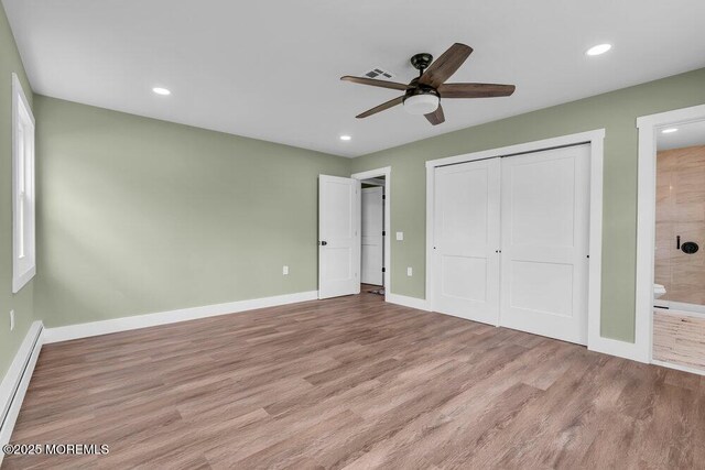 3 Andover Ct, Toms River, NJ 08757 - unfurnished bedroom with light wood-style flooring, a baseboard heating unit, recessed lighting, a closet, and ensuite bathroom