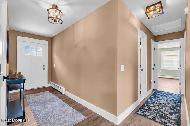 3 Andover Ct, Toms River, NJ 08757 - foyer with a baseboard radiator, baseboard heating, wood finished floors, and plenty of natural light