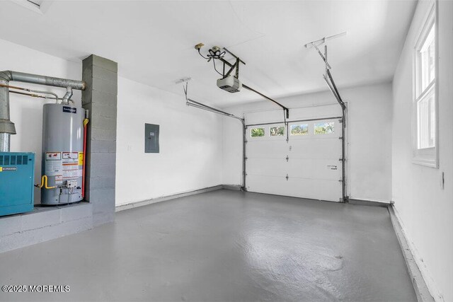 3 Andover Ct, Toms River, NJ 08757 - garage with gas water heater, electric panel, and a garage door opener