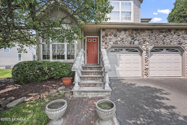 28 Brent Dr, Howell, NJ 07731 - view of front of home featuring stone siding, entry steps, and asphalt driveway