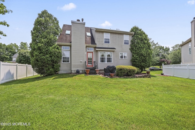 28 Brent Dr, Howell, NJ 07731 - back of property with entry steps and a chimney
