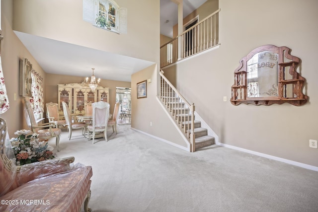 28 Brent Dr, Howell, NJ 07731 - carpeted living room with stairway, a chandelier, and a towering ceiling
