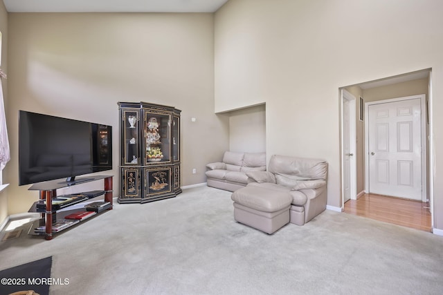28 Brent Dr, Howell, NJ 07731 - carpeted living area featuring baseboards and a towering ceiling
